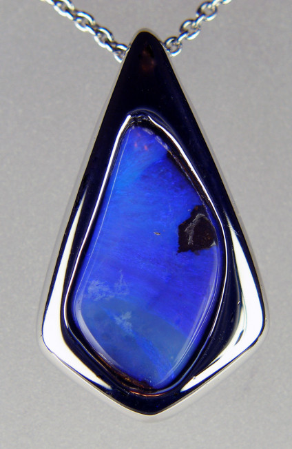 Boulder opal pendant in silver - Vivid blue boulder opal in silver. Pendant is 28 x 18mm. Boulder opal is from Queensland, Australia.