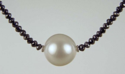 South Sea Pearl & Black Diamond Necklace - 13.5mm top quality South Sea pearl set between 18ct white gold washers and suspended from a necklace of 21ct of faceted black diamond beads with an 18ct white gold clasp