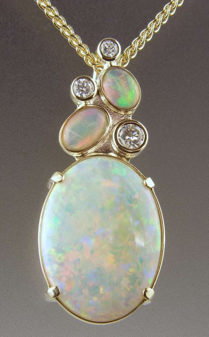 Opal & Diamond Pendant - Oval white opal and diamond pendant in 9ct yellow gold