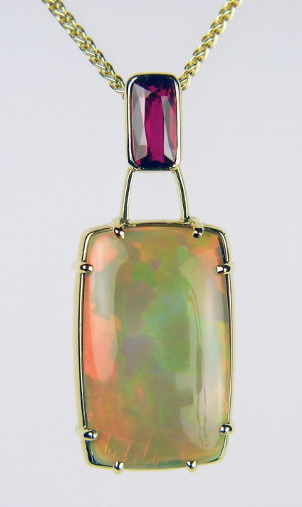 Ruby & opal pendant - 2.05ct cushion cut ruby, with independent certification confirming natural colour and origin, set with 17.99ct rectangular cushion cut cabochon Ethiopian opal in 18ct yellow gold
