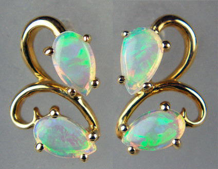 Opal earstuds in 9ct yellow gold - 0.60ct of beautiful white opal pear cut cabochons in 9ct yellow gold earstuds. Earstuds are 11x8mm.