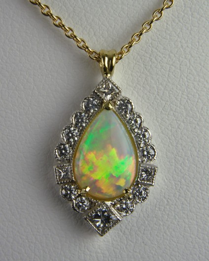 Opal & diamond pendant - Pear cut opal 1.13ct set with 0.38ct diamonds in 18ct white & yellow gold