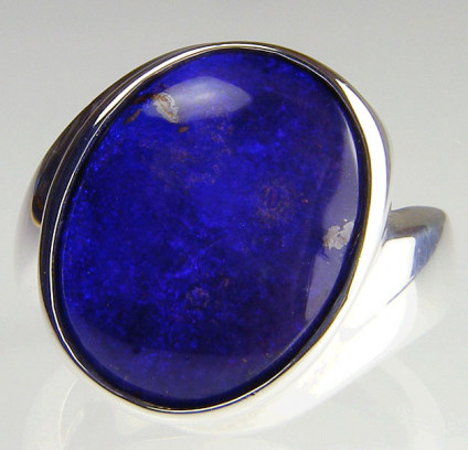 Boulder opal ring in silver - Solid boulder opal oval cabochon set in handmade silver ring. Opal is 13 x 16mm. The ring is size P1/2. This item is included in our 20 year anniversary 50% sale and now costs £97.50