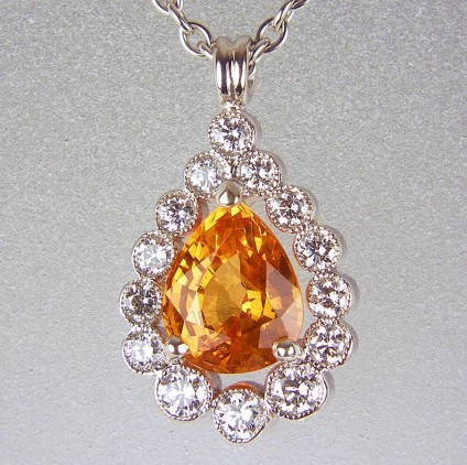 Spessartine garnet & diamond pendant - Pear cut spessartine (mandarin) garnet  0.98ct set with 0.18ct diamonds in 18ct white gold pendant.
