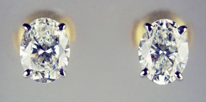 Oval diamond earstuds in 18ct white & yellow gold - Matched pair of 0.97ct and 0.95ct oval white diamonds both G colour VS clarity with GIA diamond reports, mounted in 18ct white and yellow gold with loss-proof (alpha) fittings