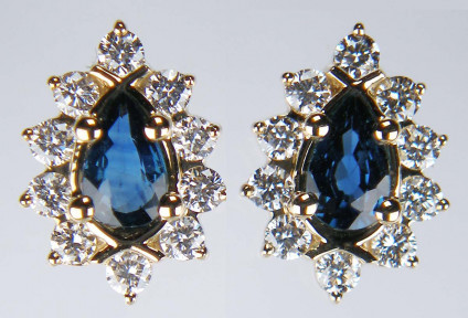 Pear cut sapphire & diamond earstuds in 9ct yellow gold - 0.49ct pear cut sapphire pair, halo set with 0.33ct of round brilliant cut diamonds set in 9ct yellow gold eartsuds. The diamonds in these earstuds are especially bright and sparkly!