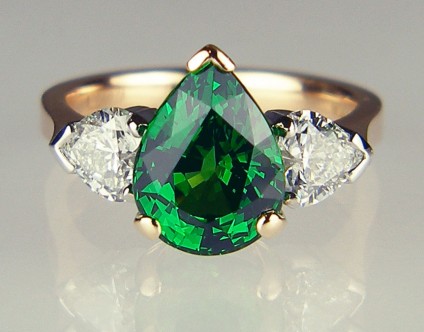 Tsavorite garnet & heart shaped diamond ring in rose gold - 3.39ct pear cut tsavorite garnet flanked by a 0.81ct matched pair of G colour VS clarity heart shaped diamonds mounted in platinum and 18ct rose gold