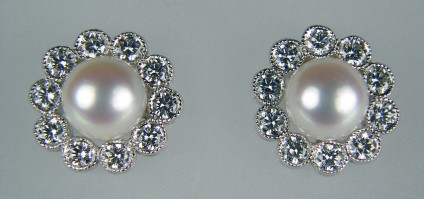 Pearl and Diamond Earrings - Pearl and 0.46ct diamond cluster earrings in 18ct white gold