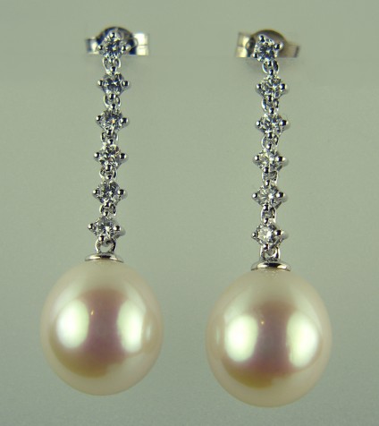 Pearl and Diamond Earrings - Pearl and 0.37ct diamond earrings in 18ct white gold. Pearls approximated 10mm in length.  Total earring drop 30mm.