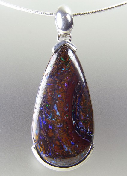 Boulder opal pendant in silver - Boulder opal pendant in silver on silver cable. Pendant 22x55mm.
