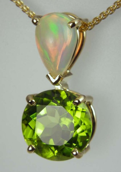 Peridot & opal pendant - 10mm round, 4.19ct round brilliant cut peridot set with 0.86ct Ethiopian opal pear shaped cabochon in 18ct yellow gold.