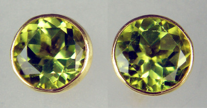 5.5mm round peridot earstuds rubover set in 9ct yellow gold - 1.15ct pair of round cut peridots rubover set in 9ct yellow gold earstuds. Earstuds are 5.5mm in diameter
