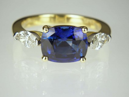 Sapphire & Diamond Ring - 2.78ct Madagascan rectangular cushion cut sapphire set with 0.48ct F colour VS clarity marquise cut diamonds.  Diamonds mounted in platinum, sapphire and ring shank in 18ct yellow gold.