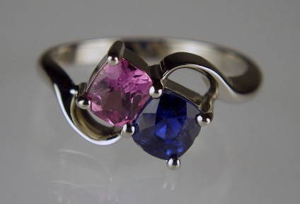 Pink & Blue Sapphire Ring - 0.60ct pink sapphire and 0.97ct blue sapphire cushion cut set in palladium