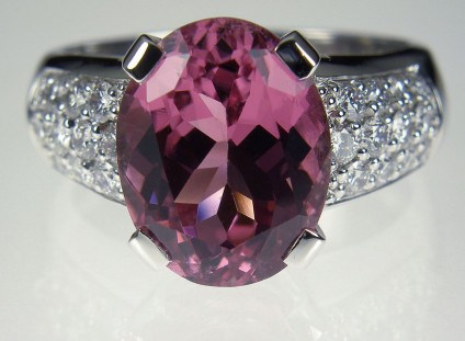 Pink tourmaline & diamond ring - Pink Tourmaline & Diamond Ring. Ring of 5.27ct oval pink tourmaline set with 0.66ct diamonds in 18 carat white gold Central stone 10 x 12mm.
