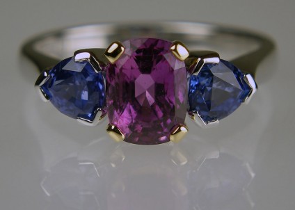 Purple & Blue Sapphire Ring - 2.08ct cushion cut rectangular purple sapphire set with a pair of 1.23ct trillion cut blue sapphires set in 18ct white and yellow gold
