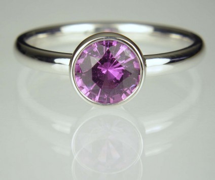 Purple Sapphire Ring - 1.11ct round brilliant cut purple sapphire (certified unheated) in 18ct white gold rubover set ring