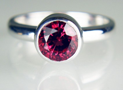 Red spinel ring in 18ct white gold - 7mm round 1.79ct red spinel set in 18ct white gold ring with rubover setting