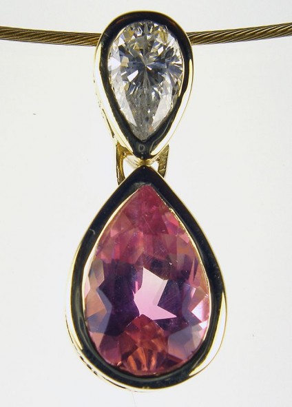 Pink tourmaline & diamond pendant - Pink tourmaline & diamond pendant set with 0.3ct diamond and 1ct tourmaline in 18ct yellow gold on 18ct yellow gold cable.						
		
							
