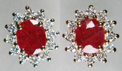 Ruby & diamond cluster earstuds in 9ct yellow gold - Oval ruby pair - included natural heat treated but NOT glass filled - weighing 1.87ct, claw set and surrounded by 0.54ct of round brilliant cut white diamonds, in 9ct yellow gold earstuds. Earstuds measure 9 x 10mm.