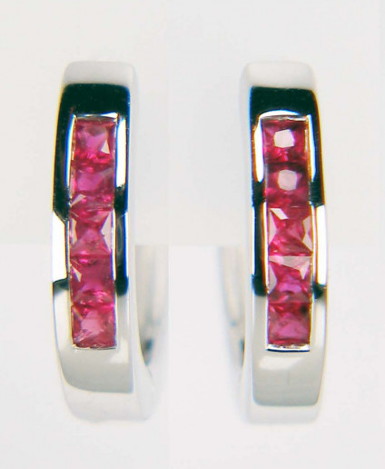 Ruby huggie earhoops in 9ct white gold - Cute, comfortable and practical ruby huggie earhoops in 9ct white gold. Earhoops are fully circular and measure 15mm outside diameter. They contain 0.40ct of princess cut fine quality rubies. These earhoops are included in our 20 year anniversary 50% sale and now cost £297.50