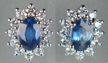 Sapphire & diamond earstuds in 9ct white gold - Lovely pair of oval blue sapphires weighing 0.86ct surrounded by a halo of white brilliant cut diamonds weighing 0.33ct, all claw set in 9ct white gold. The earstuds measure 7 x 9mm.