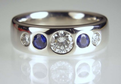 Sapphire & diamond ring in palladium - 0.32ct diamond F/SI1 set with 0.27ct pair of round cut blue sapphires and a 0.12ct pair of F/VS diamonds in palladium