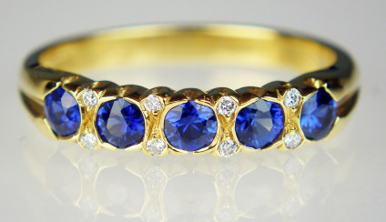 Sapphire & diamond ring in 18ct yellow gold - 0.55ct sparkling royal blue sapphires set with 0.04ct diamonds in 18ct yellow gold ring. Ring size M. Can be sized up, but now down!