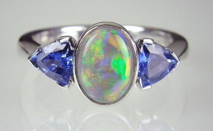 Black opal & sapphire ring - Sapphire & opal ring - Ring set with 1.15ct black opal and 0.91ct pair of trillion cut sapphires.