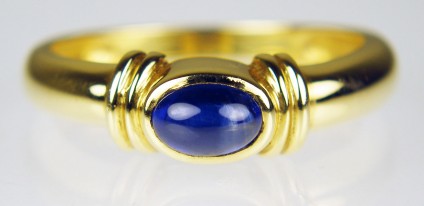Sapphire cabochon ring in 18ct yellow gold - 0.5ct oval cabochon sapphire mounted in simple 18ct yellow gold ring