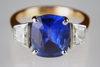 Cushion cut sapphire and trapeze cut diamond ring in rose gold - 4.06ct cushion cut Sri Lankan sapphire, a stunning shade of natural blue, set with 0.74ct pair of trapezoidal cut diamonds in G colour VS-SI clarity and mounted in platinum and on a rose gold shank.