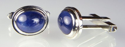Cabochon sapphire cufflinks in gold - 13.09ct pair of cabochon cut blue sapphires set in 9ct white gold