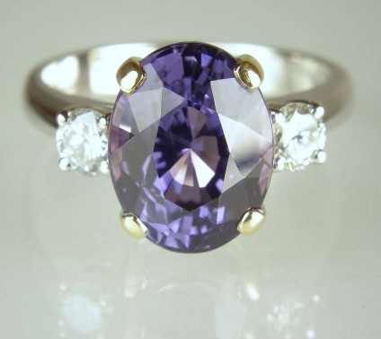 Spinel & diamond ring - 5.46ct oval cut lilac blue spinel set with 0.4ct matched pair of round brilliant cut diamonds in 18ct yellow and white gold handmade ring