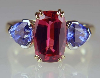 Red spinel and blue sapphire ring - Rectangular cushion cut red spinel set with a matched 1.29ct pair of trillion cut blue sapphires in platinum and 18ct yellow gold