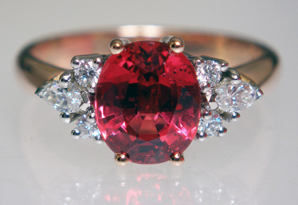 Red spinel & diamond ring - 2.15ct oval Burmese red spinel, flanked by 0.25ct of round brilliant and marquise cut diamonds in E/F colour VS clarity. The spinel is claw set in 18ct rose gold and the diamonds are claw set in platinum. The ring shank is hallmarked 18ct gold & platinum.