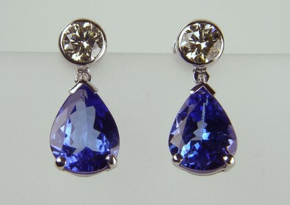 Tanzanite & diamond earrings - 0.71ct diamond pair in 18ct white rubover earstuds with 3.34ct pear cut tanzanite pair of detachable drops
