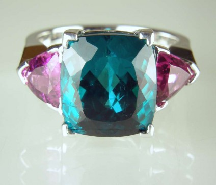 Tourmaline ring - 9.33ct superb teal coloured cushion cut tourmaline from Afghanistan flanked by a 1.58ct matched pair of trillion cut pink tourmalines in a handmade 18ct white gold ring