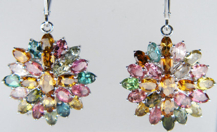Multigem tourmaline cluster eardrops in silver - Pretty multicoloured large cluster of marquise and oval cut tourmalines set in rhodium lated silver. The cluster drop are suspended from continental fitting earhoops. The cluster drops are 24mm in diameter. These earrings are incuded in our 20 year anniversary sale and are now £74.5