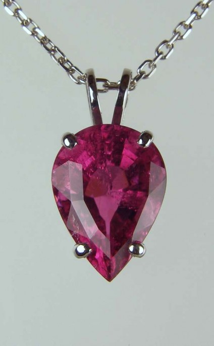 Tourmaline pendant in platinum - 3.93ct pear cut deep red/pink tourmaline, mounted as a pendant in platinum and suspended from an 18" platinum chain
