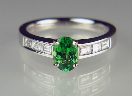 Tsavorite & diamond ring in 18ct white gold - 0.78ct oval cut tsavorite garnet set with 0.28ct baguette cut diamonds in 18ct white gold