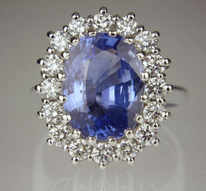 Sapphire & diamond ring - 6.05ct cushion cut Sri Lankan sapphire set with 1.08ct round brilliant cut diamonds in F colour VS clarity in 18ct white gold
