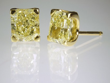Yellow diamond earrings in gold - Yellow Diamond Earrings 5ct total radiant cut fancy intense yellow diamond (GIA certificated) earrings in 18ct yellow gold.