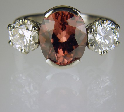 Zircon & diamond ring in platinum - Ring of 3.06ct Tanzanian pinkish brown oval zircon set with a 2 x 0.7ct I/SI1 diamonds in platinum.