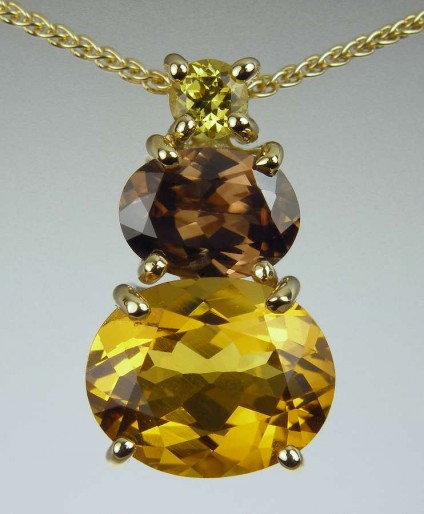 Golden beryl, zircon & garnet pendant - 2.99ct oval cut golden beryl, set with 1.61ct brown zircon from Myanmar, and 0.2ct Mali garnet in 18ct yellow gold